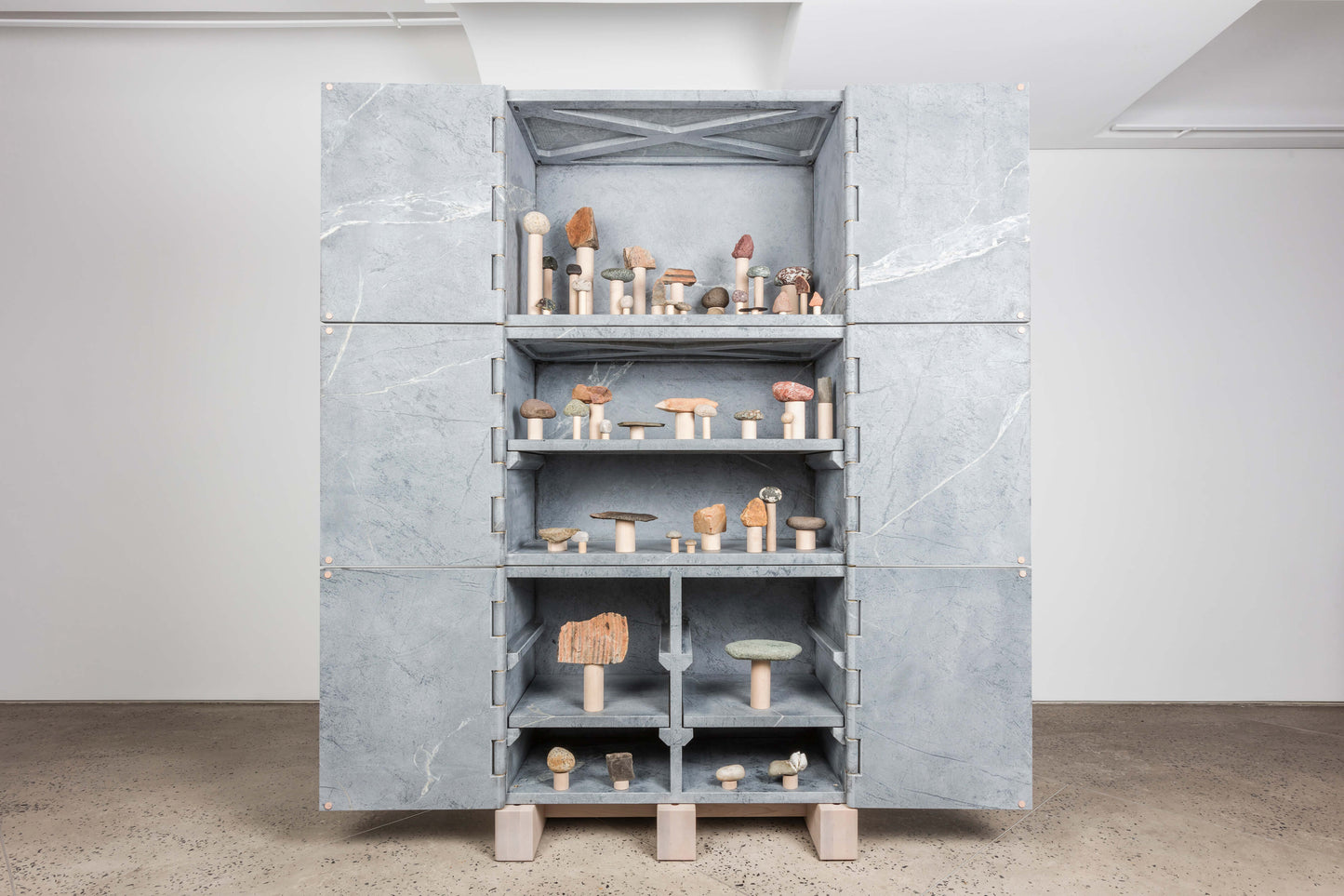 Photo: Chamber Projects || Six Door Relief Stone Cabinets