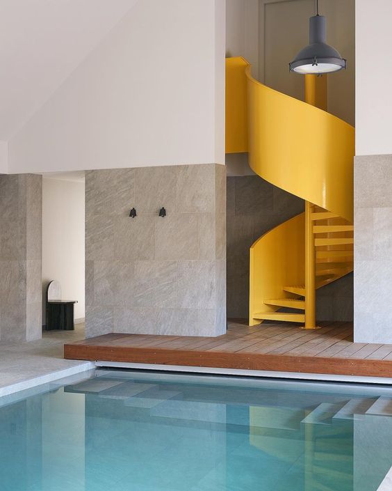 Interior: Studio Asai & Triode Design.  Photo: Adrien Dirand || Stone Tombstone Chair by a pool